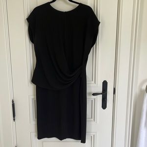 St. John black dress with side drape detail and open slit at neck. Size 12